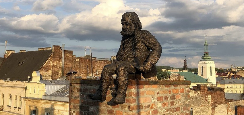 Sculpture a chimney sweep on the roof of the House of Legends in Lviv, Ukraine